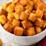 a white bowl full of cornbread croutons