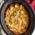overhead photo of crockpot stuffing in a slow cooker