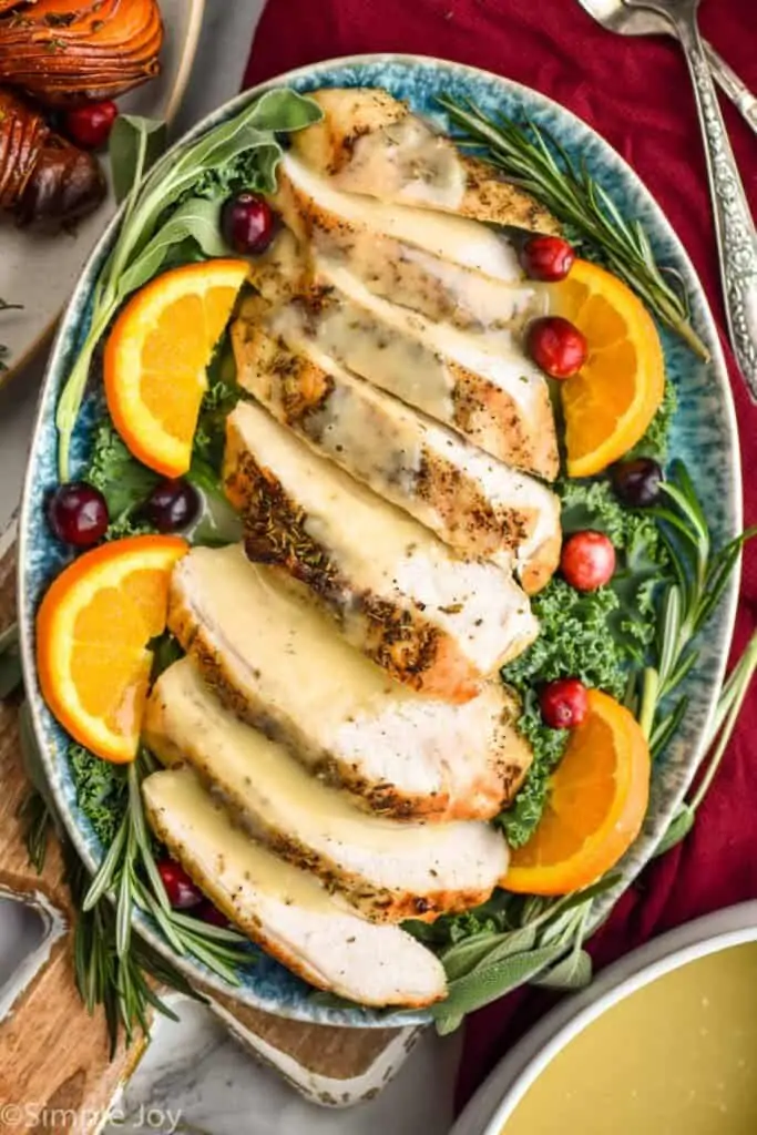 overhead of a platter of crockpot turkey breast and gravy