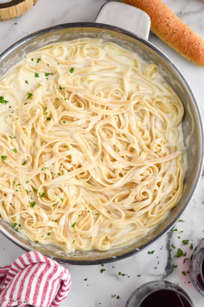 overhead of a pan of fettuccine alfredo 
