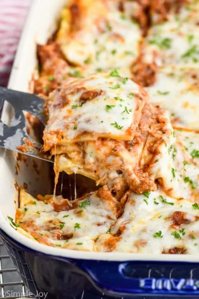 ground turkey lasagna recipe being dished out of a baking dish