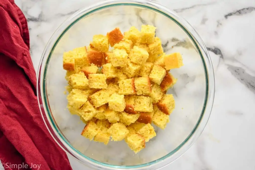 overhead of a bowl full of cubed cornbread