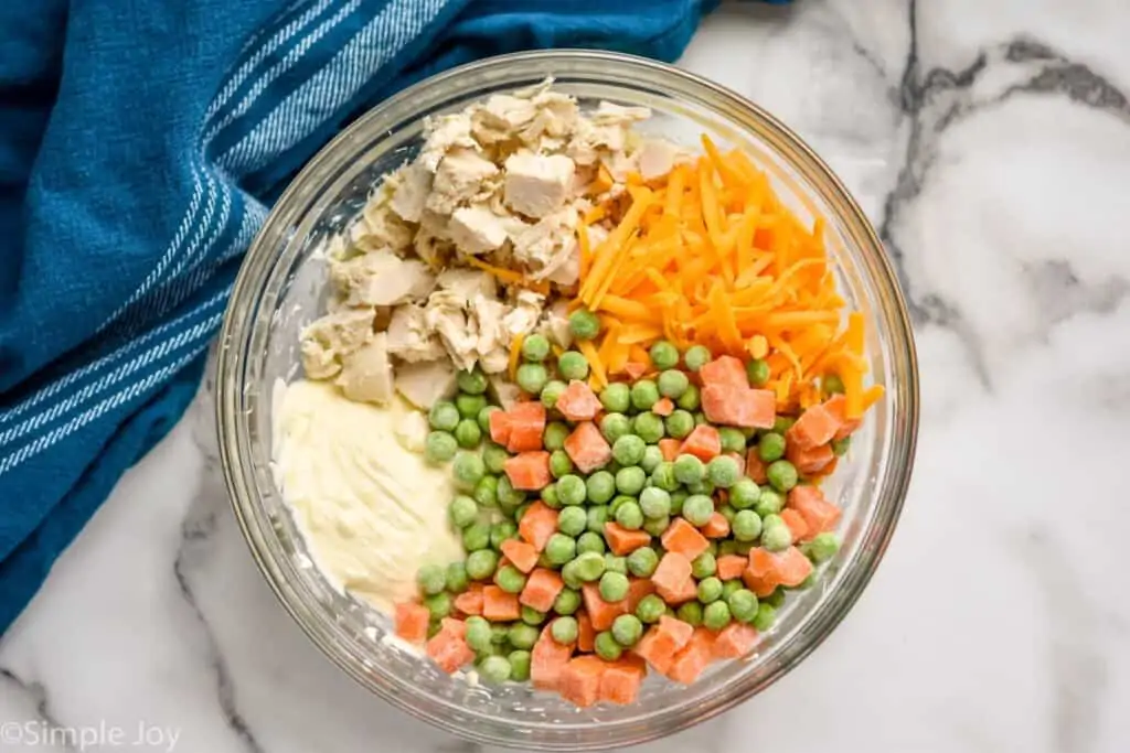 overhead of a bowl of ingredients to make filling for mini chicken pot pies