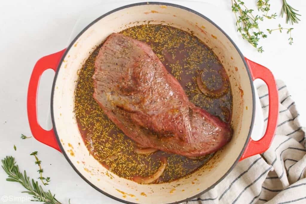 adding pot roast back to a dutch oven