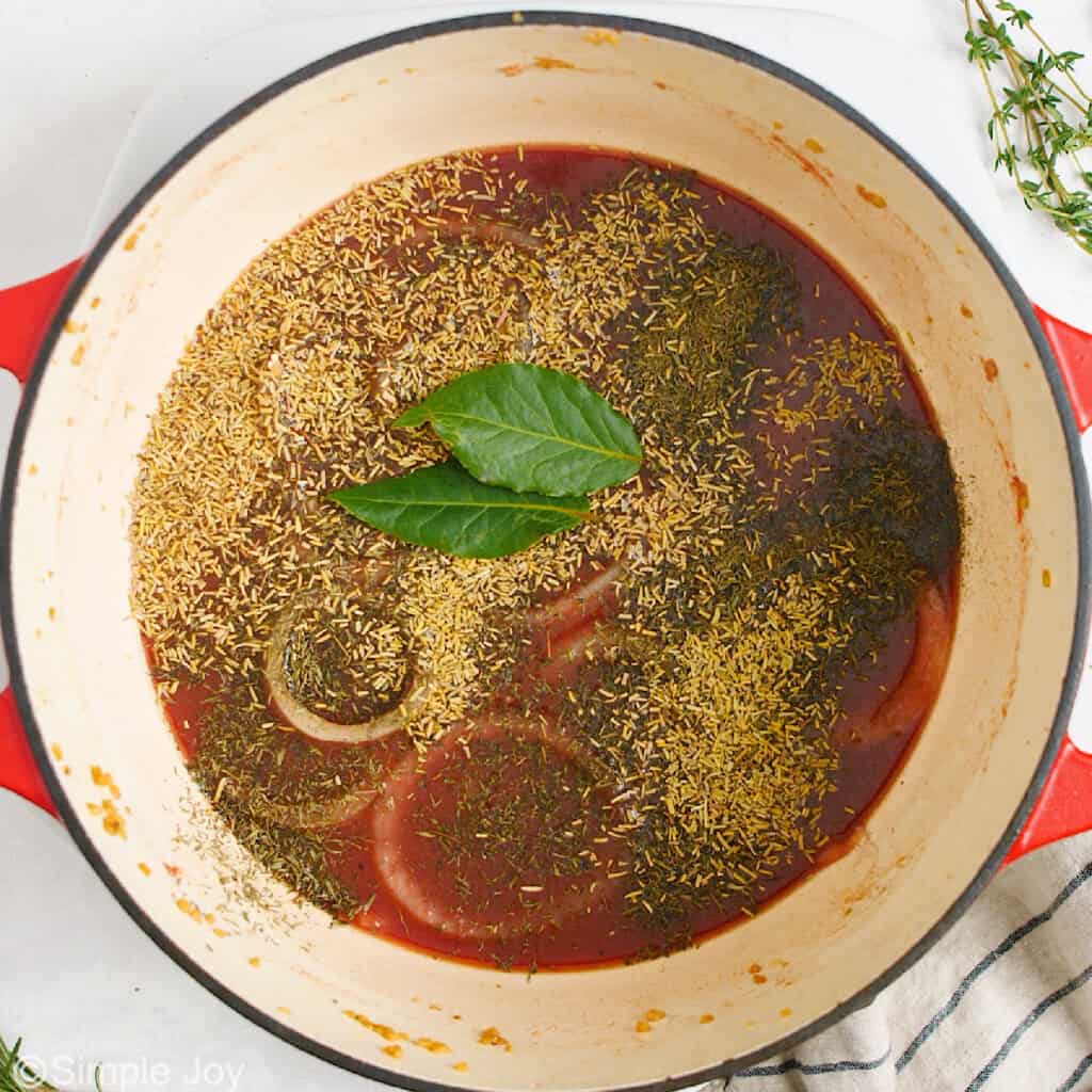 adding seasonings to a dutch oven