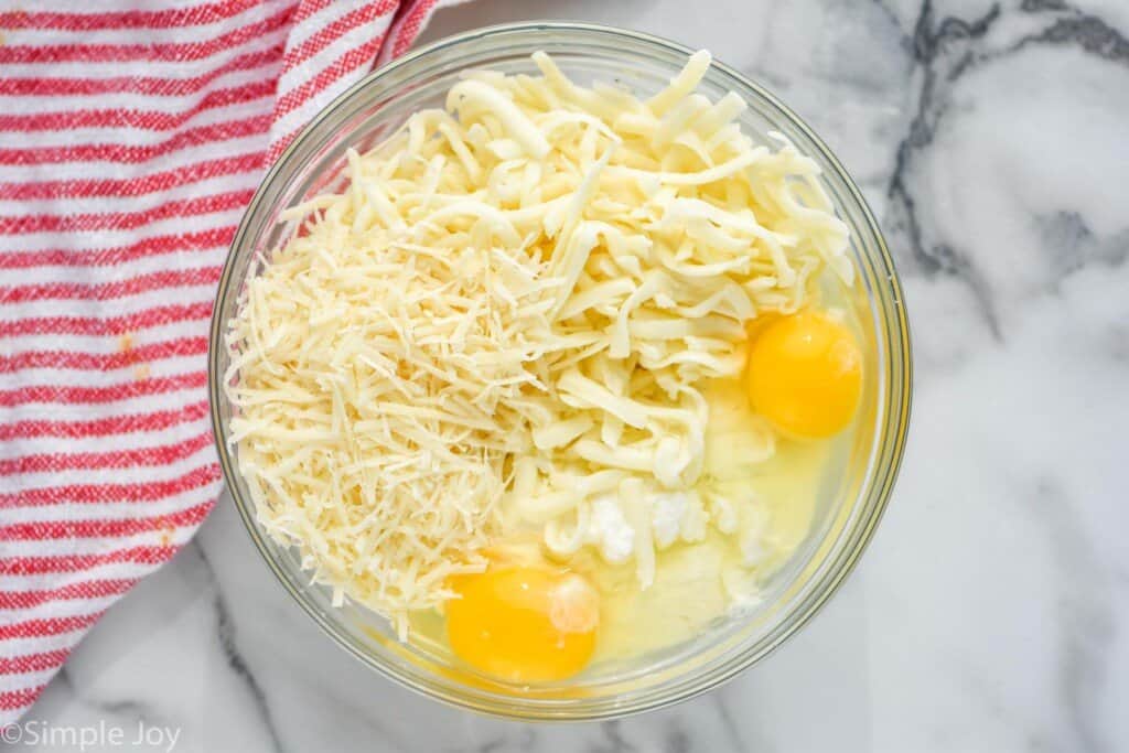 overhead of a bowl of cheese and eggs