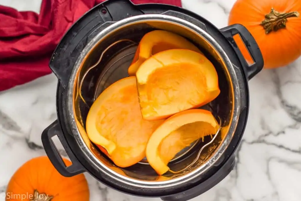 overhead of a cut up pumpkin in an instant pot