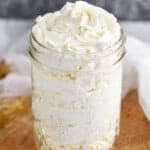 mason jar full of stabilized whipped cream frosting that has been pipped into it - 13