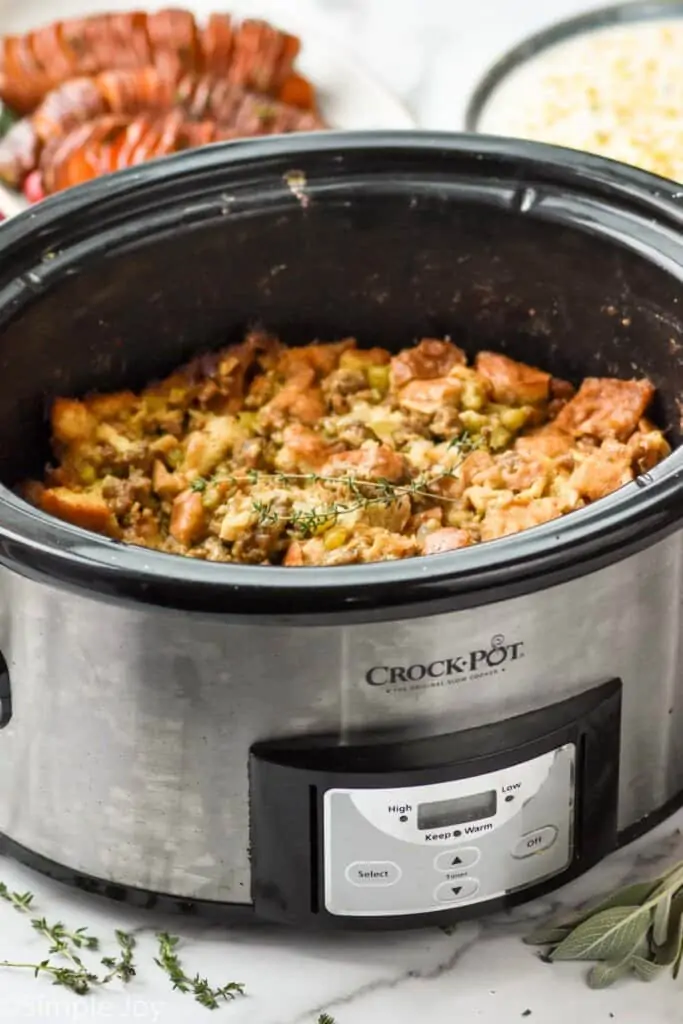 side view of a crockpot with a slow cooker stuffing recipe