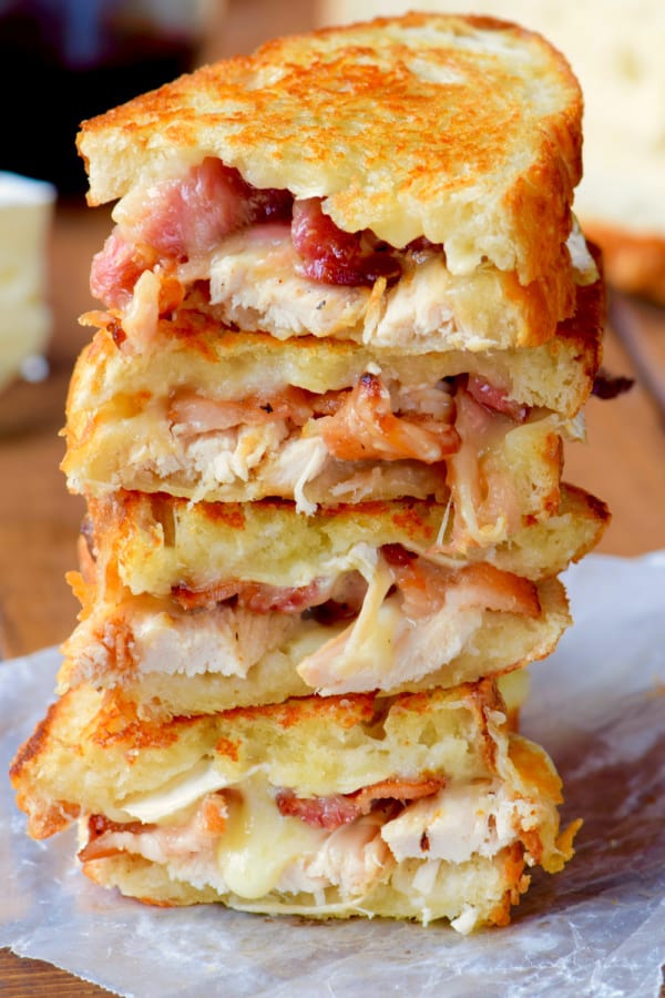 a stack of brie grilled cheese made with turkey and bacon
