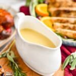 gravy recipe in a turkey boat sitting in front of a platter of turkey - 8