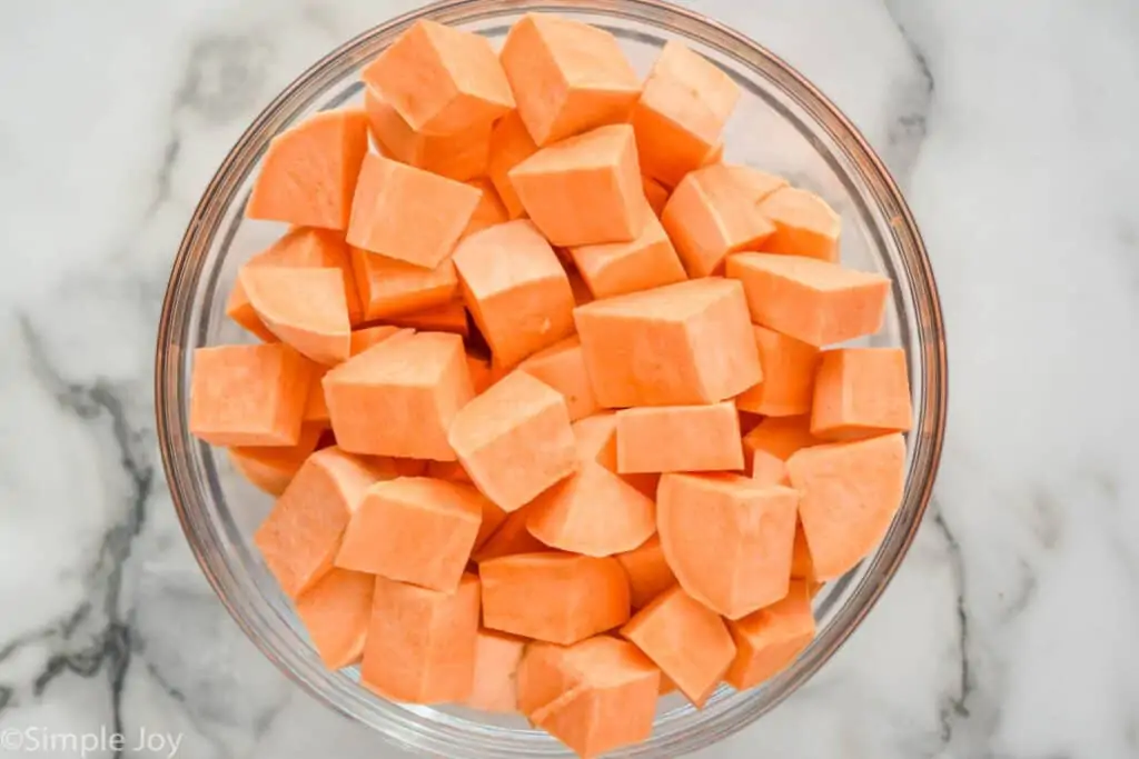 overhead of a bowl of cubed sweet potatoes uncooked