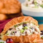 a turkey salad sandwich on a cutting board - 17