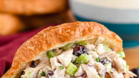 a turkey salad sandwich on a cutting board