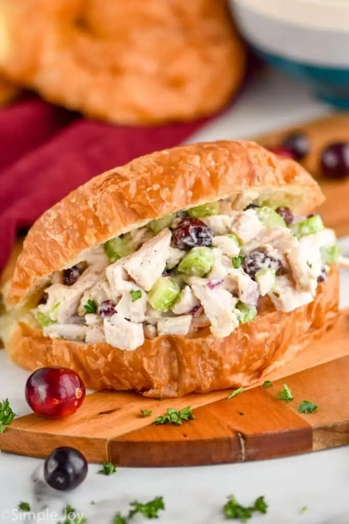 close up of a turkey salad sandwich on a cutting board