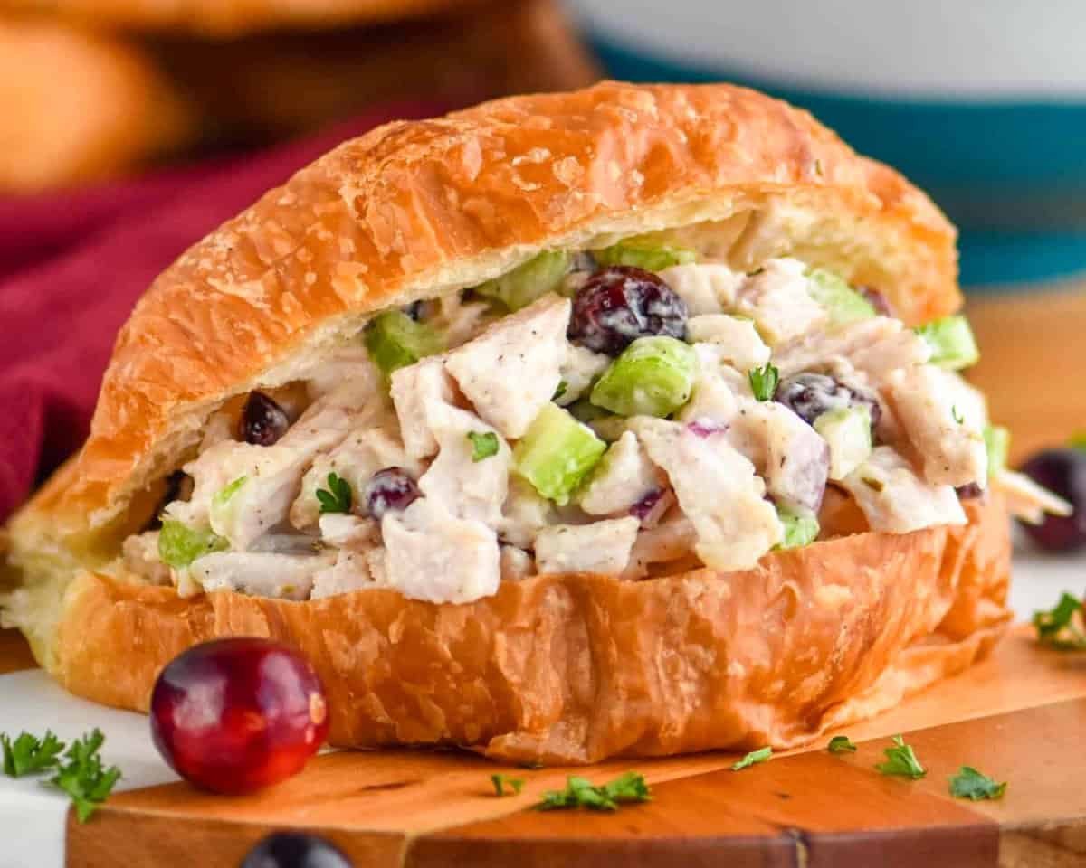 close up image of turkey salad on a croissant