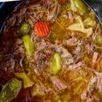 Pinterest graphic of a slow cooker full of italian beef, says: "slow cooker italian beef"