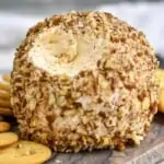 close up of a cheese ball recipe with a bit missing