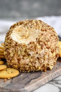 close up of a cheese ball recipe with a bit missing