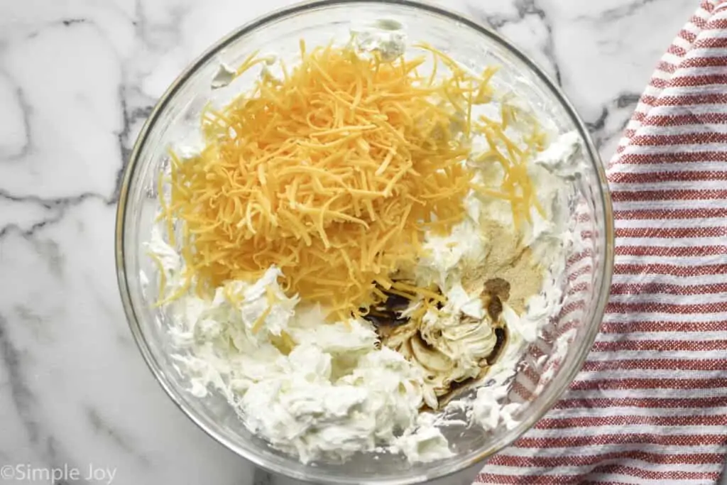 overhead view of a bowl of ingredients for to make a cheese ball