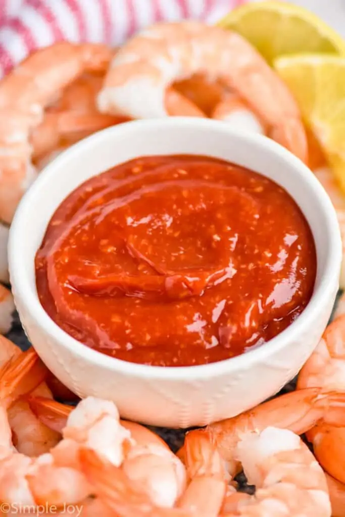 close up of a white bowl with cocktail sauce