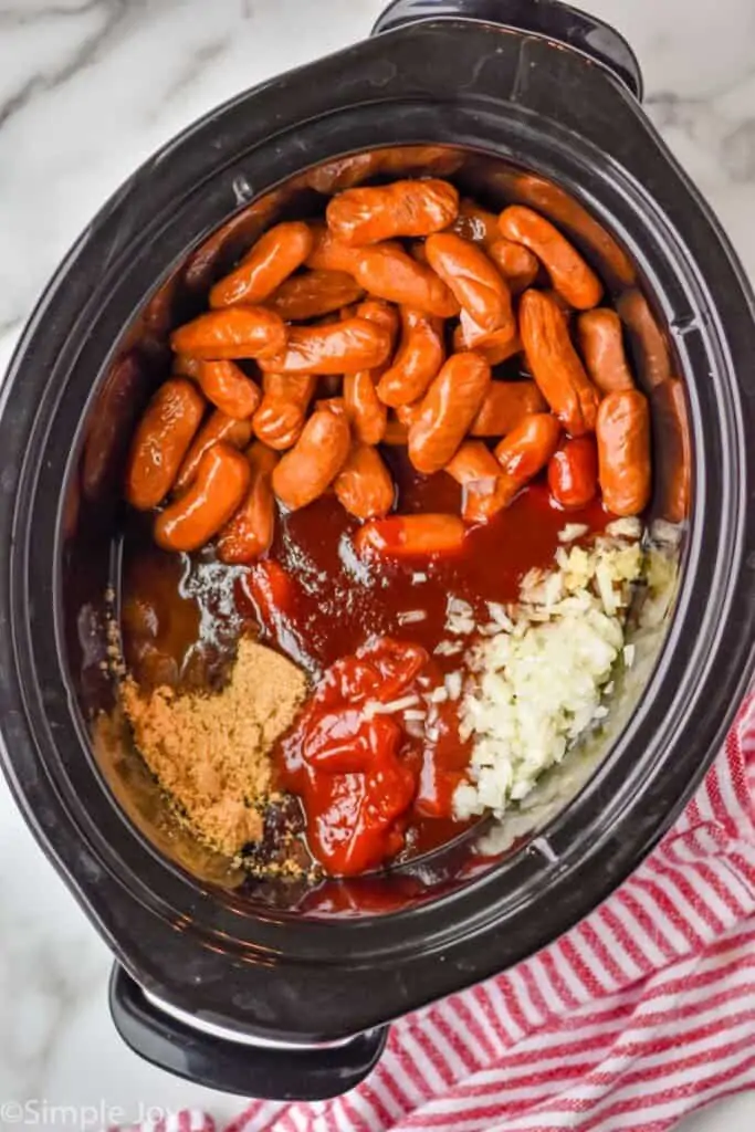 overhead view of crockpot little smokies recipe broken up by ingredient