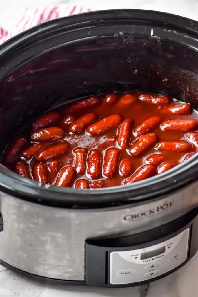 side view of crockpot little smokies in BBQ sauce