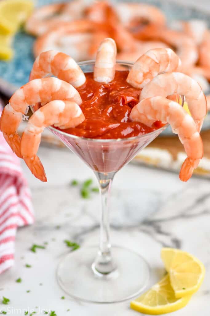 martini glass filled with shrimp cocktail sauce recipe and shrimp sticking out of it