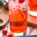 pinterest graphic oclose up of a high ball glass filled with ice and a Shirley Temple
