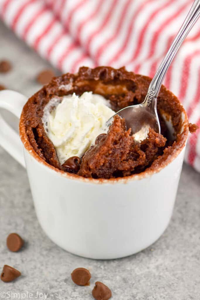 a spoon digging into a chocolate chip mug cake