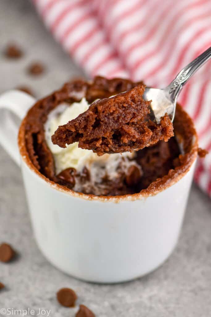 a spoon dishing up a little chocolate mug cake