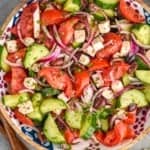 overhead view of Mediterranean salad in a bowl in a wooden bowl