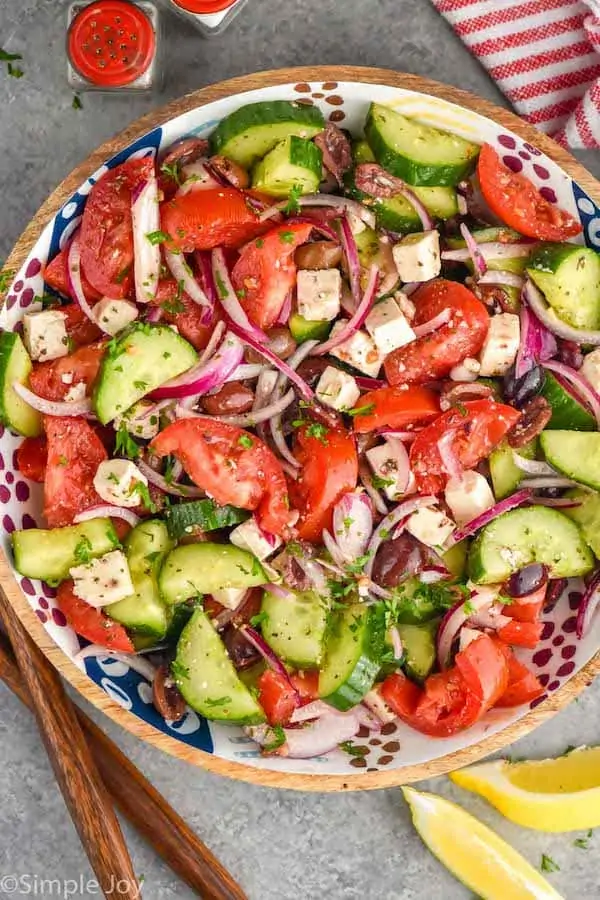 overhead view of Mediterranean salad in a bowl in a wooden bowl