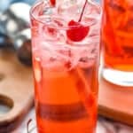 close up of a high ball glass filled with ice and a Shirley Temple