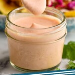 pinterest graphic of small jar of fish taco sauce with spoon dishing it up