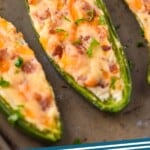 pinterst graphic of jalapeno poppers on a baking tray