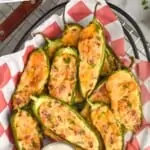 Pinterest graphic of overhead of a basket full of baked jalapeno poppers next to ranch dressing - 3