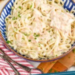 pinterest graphic of a bowl fo salmon Alfredo Pasta