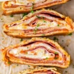 pinterest graphic of overhead of sliced pieces of stromboli on their sides