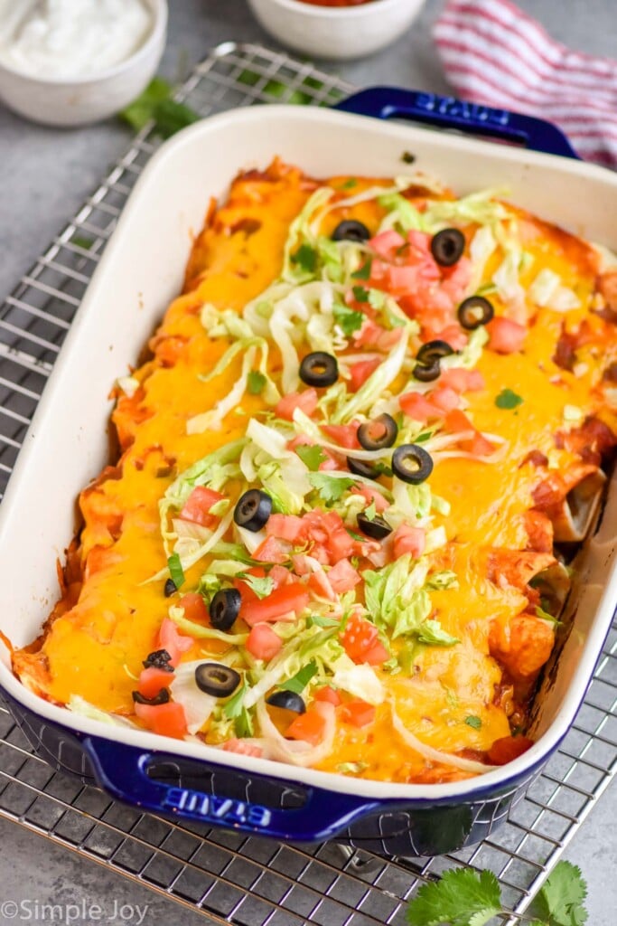 side view of a casserole dish filled with baked burritos