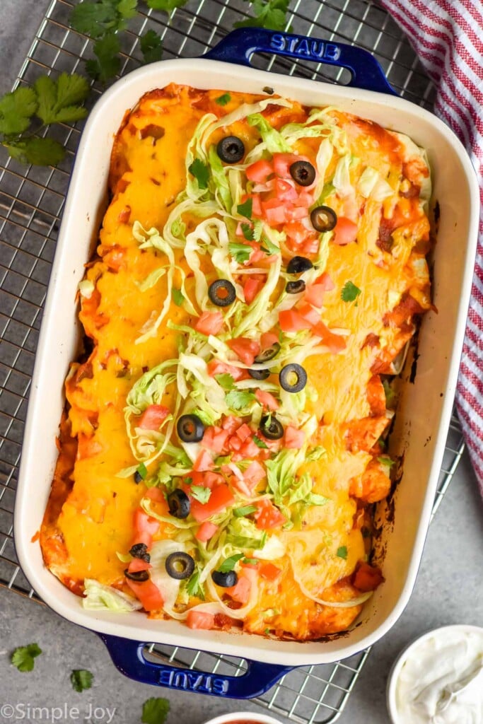 overhead of a casserole dish filled with baked burritos