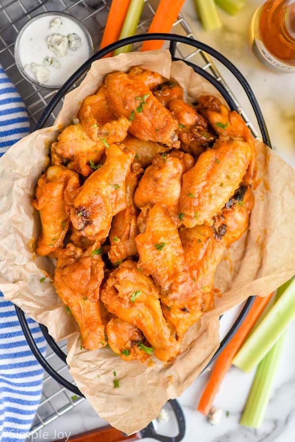 overhead of a basket of crispy baked chicken wings