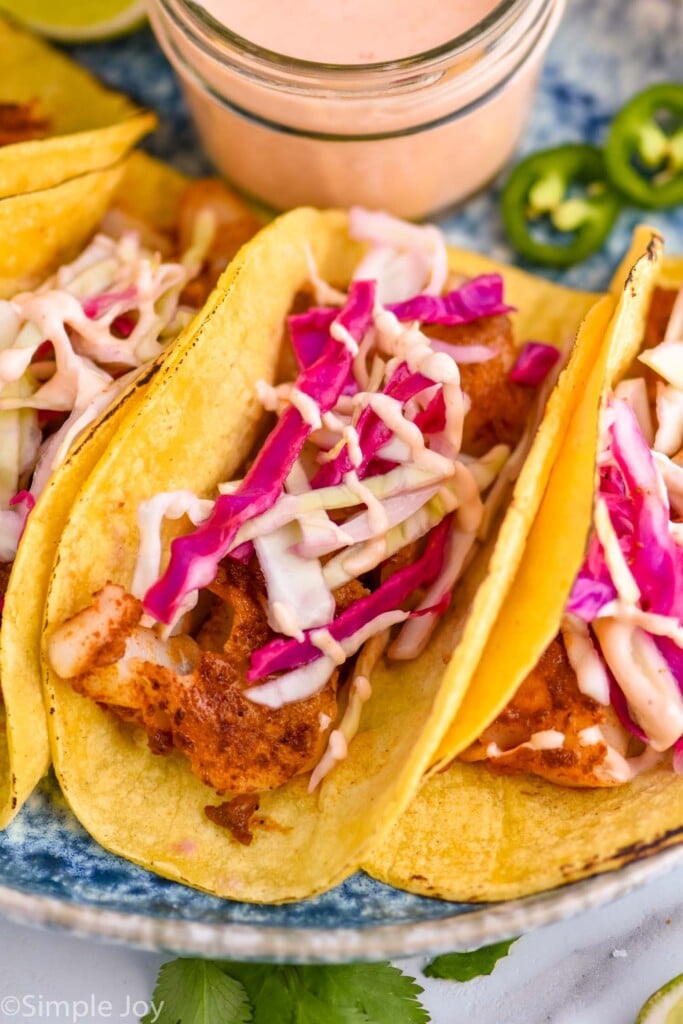 close up of a fish taco on a platter