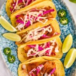 overhead of six fish tacos on a platter - 8