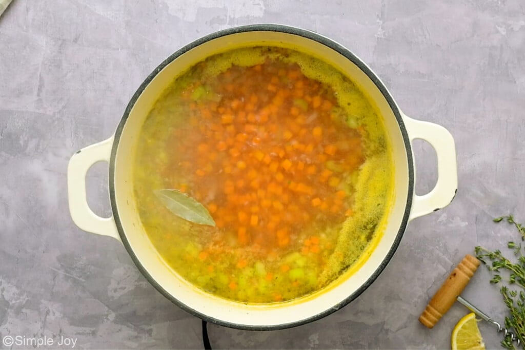 overhead of a pot boiling soup - 10