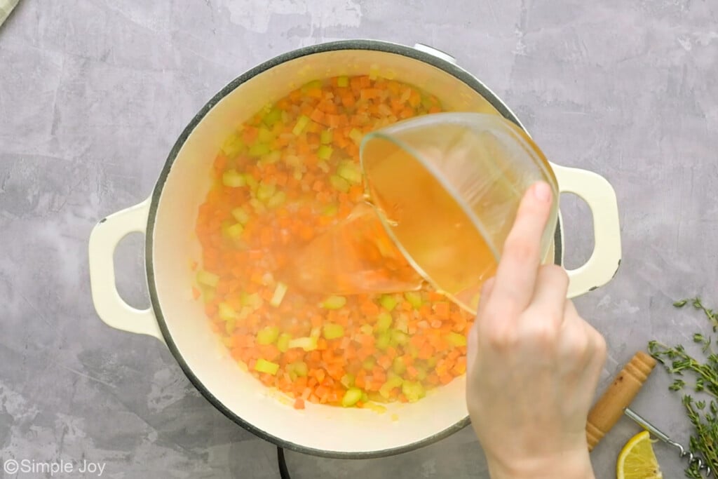 pouring wine into a pot with vegetables to deglaze the pan - 9