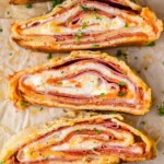 overhead of sliced pieces of stromboli on their sides
