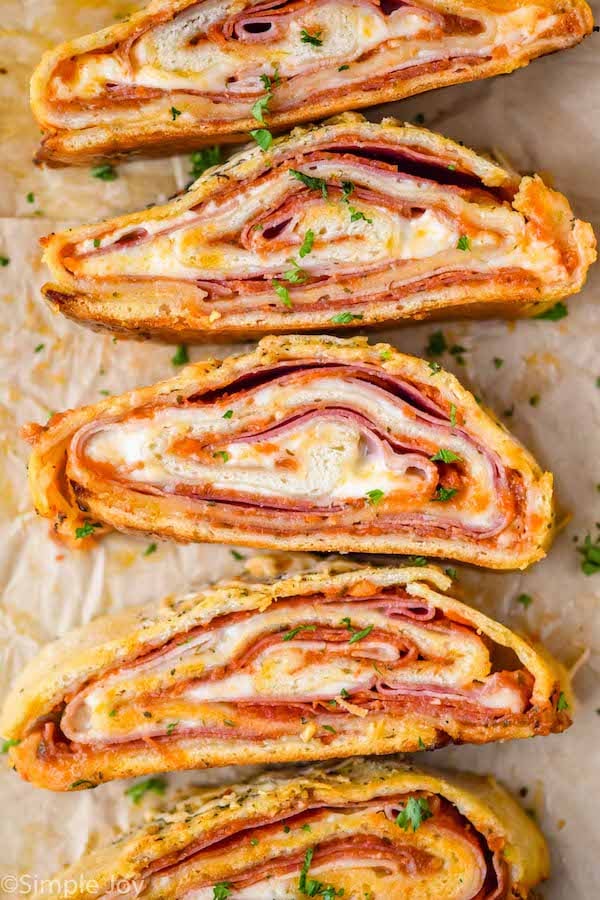 overhead of sliced pieces of stromboli on their sides