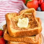 pinterest graphic of four square pieces of French toast stacked with butter on top