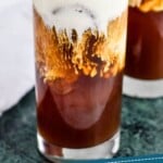 pinterst graphic of close up of an Irish cream cold brew topped with cream and garnished with coco powder